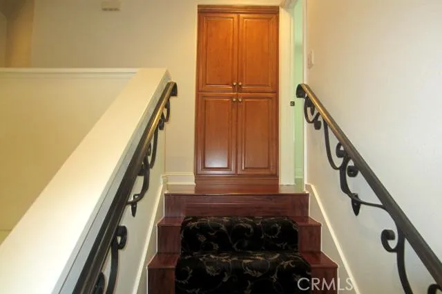 a view of stairs and with wooden floor