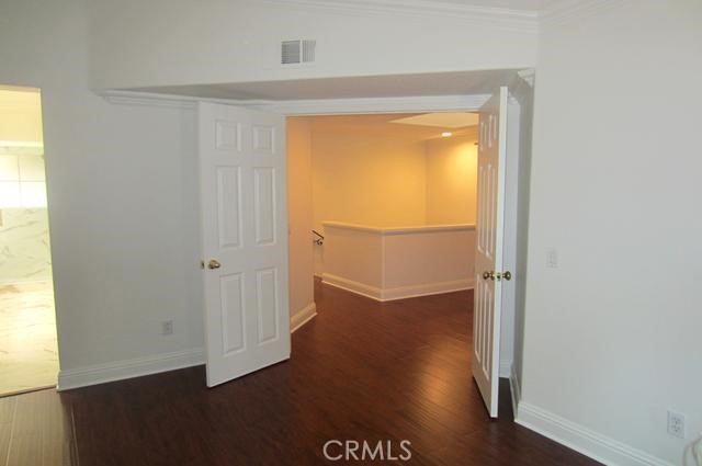 8000 East Snapdragon Lane Anaheim Hills, CA 92808 - Photo 24 of 27 an empty room with wooden floor and windows