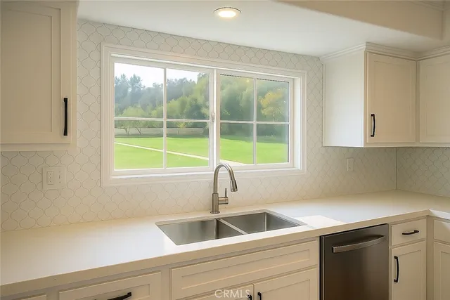 a kitchen with a sink and a window