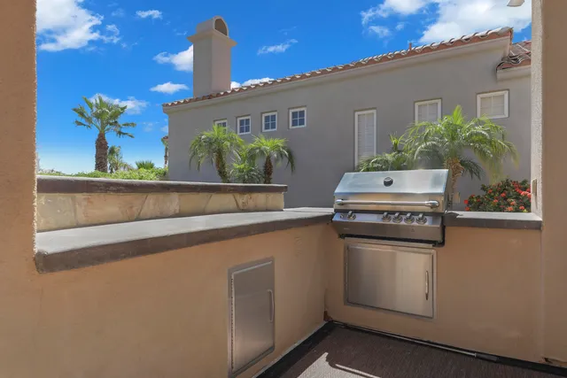a dining room with furniture and a window