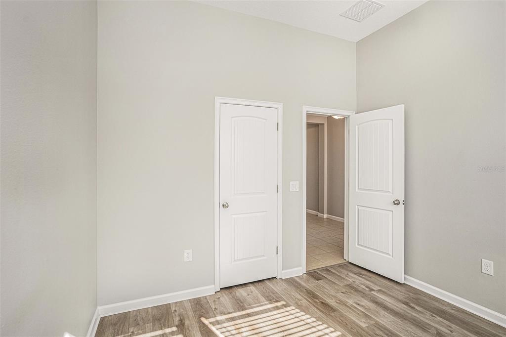 12314 Eagle Swoop Place Riverview, FL 33579 - Photo 13 of 23 a view of a room with wooden floor and closet