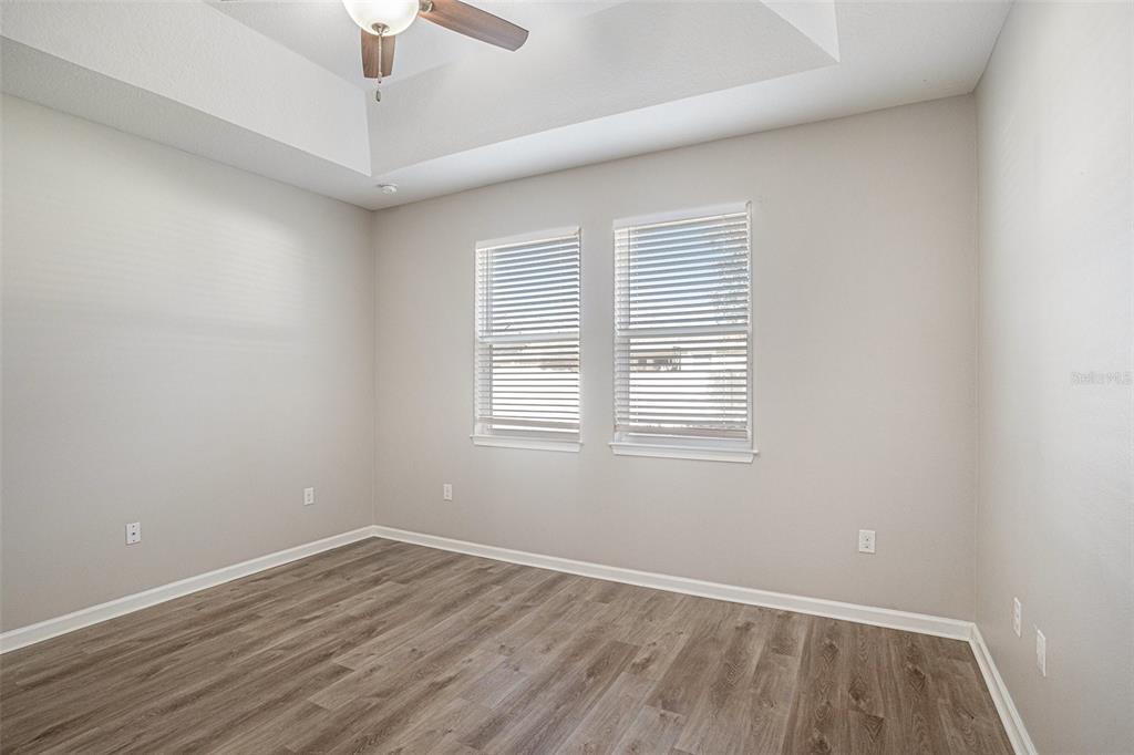 12314 Eagle Swoop Place Riverview, FL 33579 - Photo 18 of 23 wooden floor in an empty room with a window