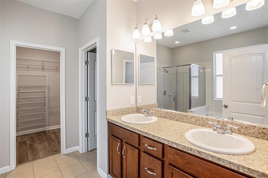12314 Eagle Swoop Place Riverview, FL 33579 - Photo 19 of 23 a bathroom with a sink double vanity and a mirror