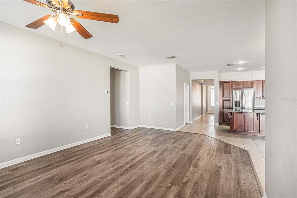12314 Eagle Swoop Place Riverview, FL 33579 - Photo 8 of 23 a view of empty room with wooden floor