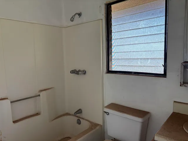 a bathroom with a bathtub and a sink