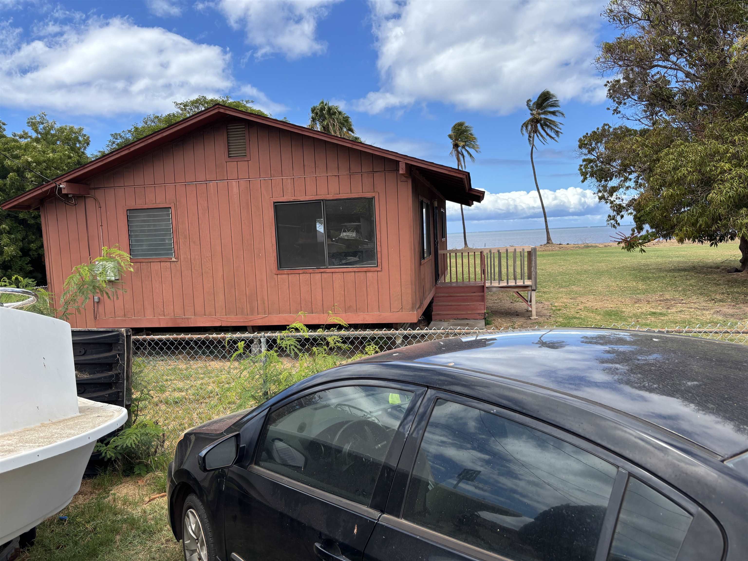 260 Seaside Street Kaunakakai, HI 96748 - Photo 2 of 17 a view of a backyard with swimming pool