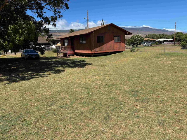 a view of a lake with a house in the background