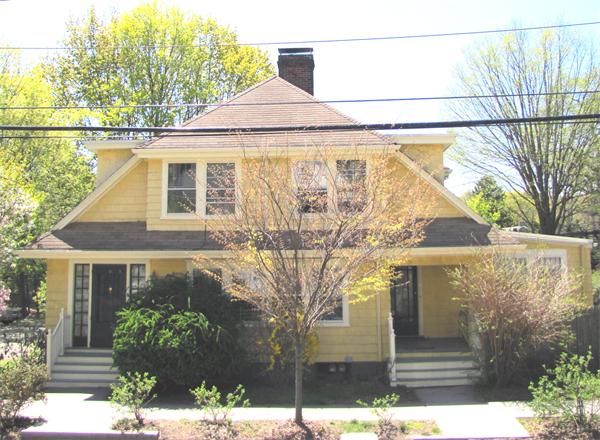 70-72 Beaconsfield Road Brookline, MA 02445 - Photo 1 of 22 a front view of a house with a yard and garage