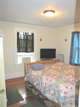 70-72 Beaconsfield Road Brookline, MA 02445 - Photo 12 of 22 a bedroom with a bed and a window