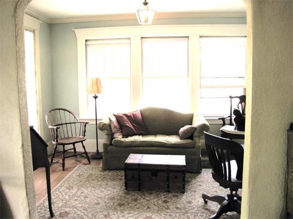 70-72 Beaconsfield Road Brookline, MA 02445 - Photo 13 of 22 a living room with furniture and a window