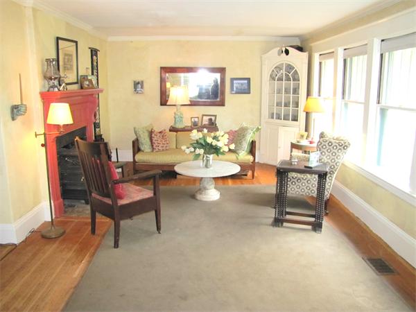 70-72 Beaconsfield Road Brookline, MA 02445 - Photo 3 of 22 a living room with furniture and a floor to ceiling window