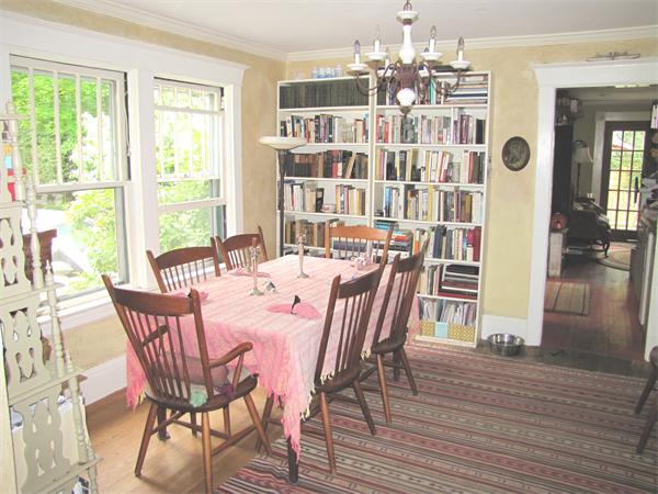 70-72 Beaconsfield Road Brookline, MA 02445 - Photo 5 of 22 a dining room with furniture a chandelier and wooden floor