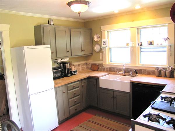 70-72 Beaconsfield Road Brookline, MA 02445 - Photo 6 of 22 a kitchen with kitchen island granite countertop a sink appliances cabinets and a counter top space