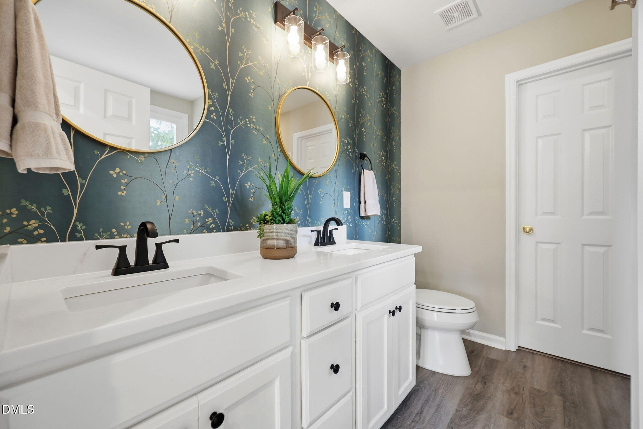 1716 Farmington Grove Drive Raleigh, NC 27614 - Photo 23 of 41 a bathroom with 2 sink and a mirror