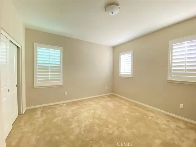 a bathroom with a double vanity sink mirror and shower