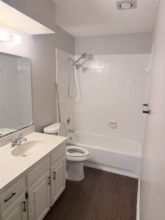 12800 Tomanet Trail, Unit B Austin, TX 78727 - Photo 11 of 12 a bathroom with a double vanity sink toilet mirror and shower