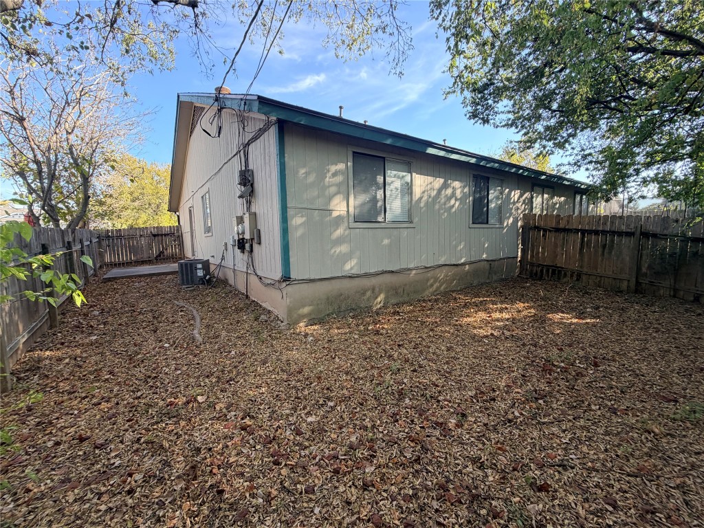 12800 Tomanet Trail, Unit B Austin, TX 78727 - Photo 12 of 12 a view of a barn in the middle of a yard