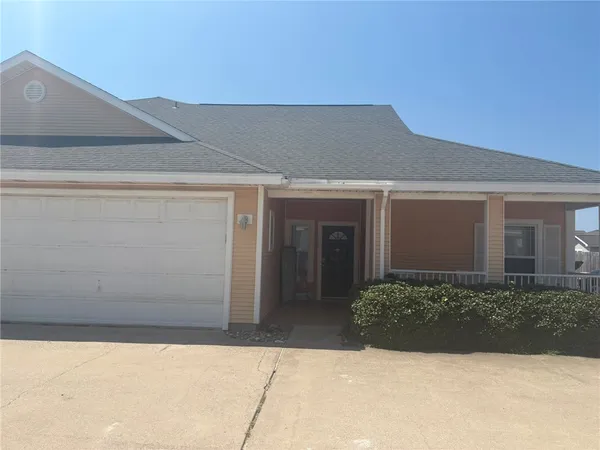 a front view of a house with garage