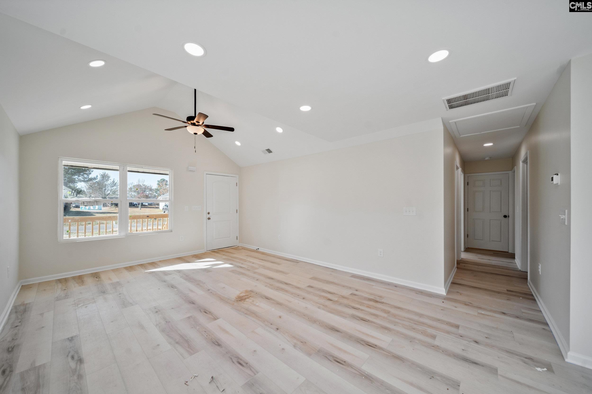 116 Sunny Acres Road Eastover, SC 29044 - Photo 9 of 40 wooden floor in an empty room with a window