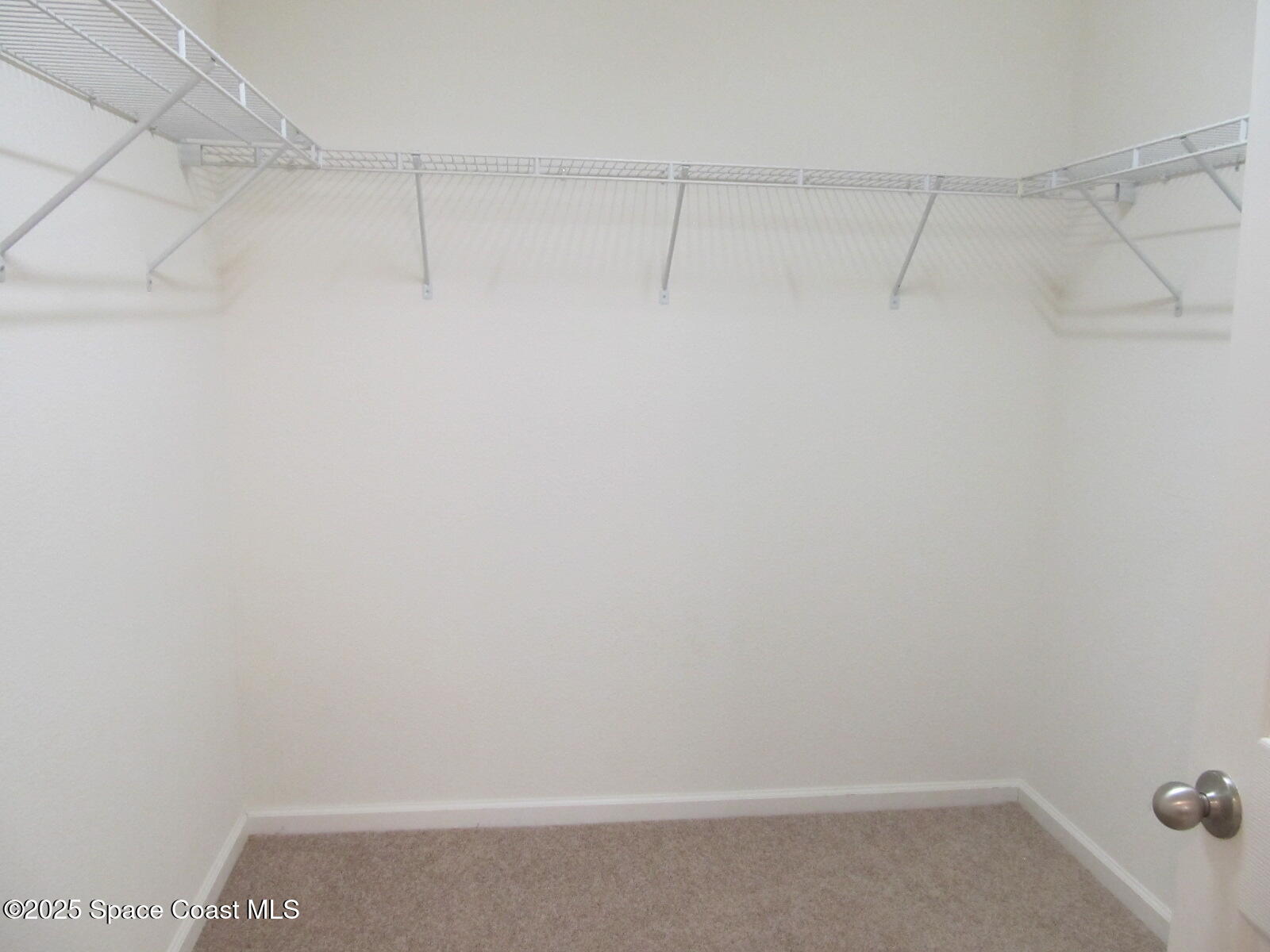 2002 Elkins Point Melbourne, FL 32935 - Photo 16 of 25 Main Bedroom Walk-In Closet