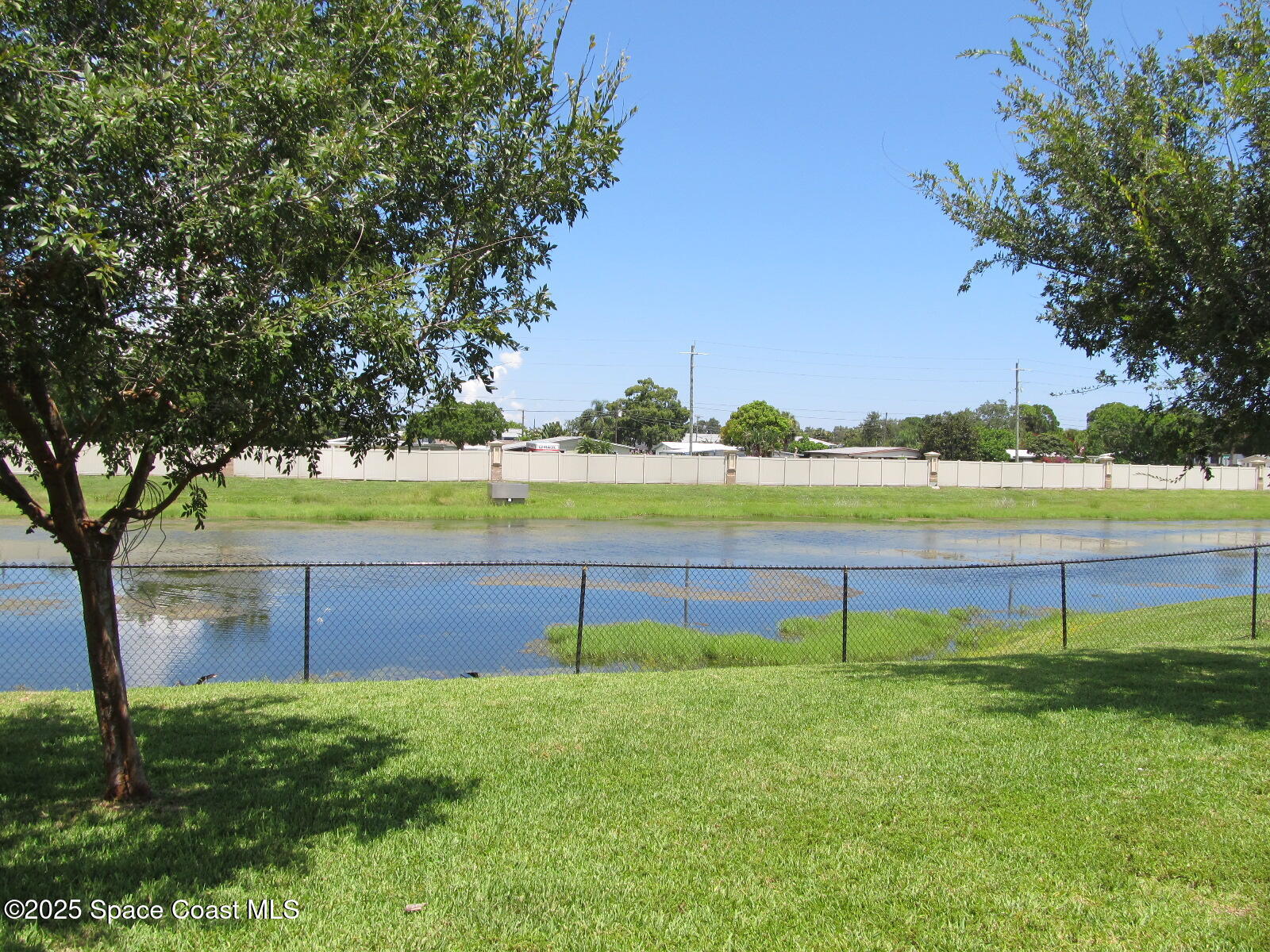 2002 Elkins Point Melbourne, FL 32935 - Photo 23 of 25 Retention Pond View from Porch