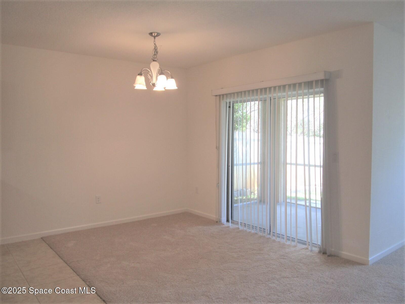 2002 Elkins Point Melbourne, FL 32935 - Photo 5 of 25 Dining Room to Porch