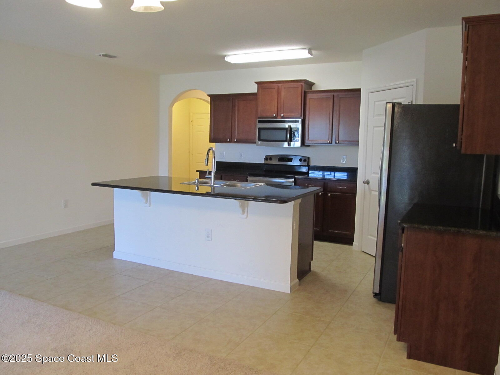 2002 Elkins Point Melbourne, FL 32935 - Photo 9 of 25 Kitchen View from Slider