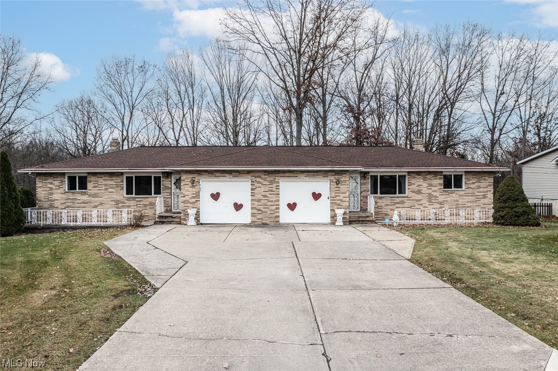 14358 Prospect Road Strongsville, OH 44149 - Photo 1 of 35 Ranch-style home with a front yard and a garage