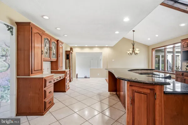 a kitchen with stainless steel appliances granite countertop a sink and cabinets