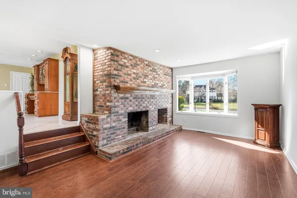 a view of a livingroom with furniture window and wooden floor