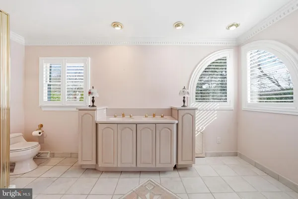 a bathroom with a shower and a mirror