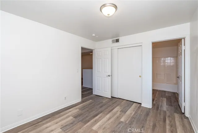 a view of hallway with wooden floor