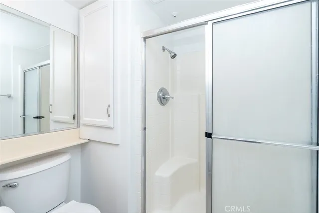 a bathroom with a shower and a sink