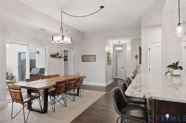 a kitchen with stainless steel appliances granite countertop wooden cabinets and a stove top oven