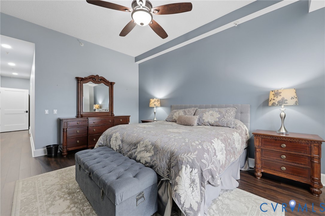 301 Beacon Ridge Drive, Unit 804 Hopewell, VA 23860 - Photo 22 of 64 a bedroom with a bed and wooden floor