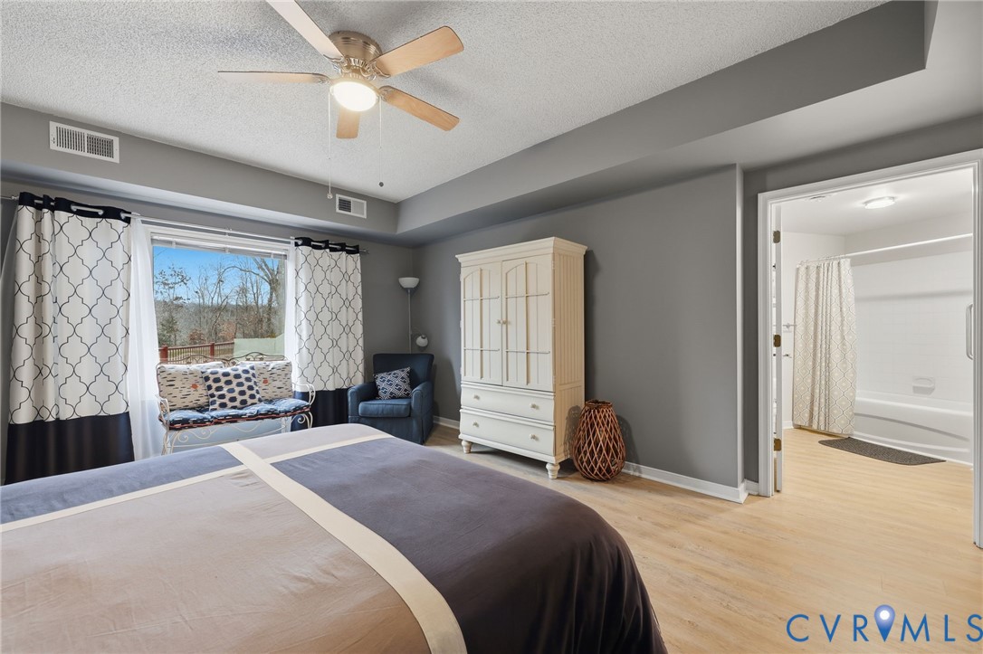 301 Beacon Ridge Drive, Unit 804 Hopewell, VA 23860 - Photo 44 of 64 a bedroom with a large bed and a large window