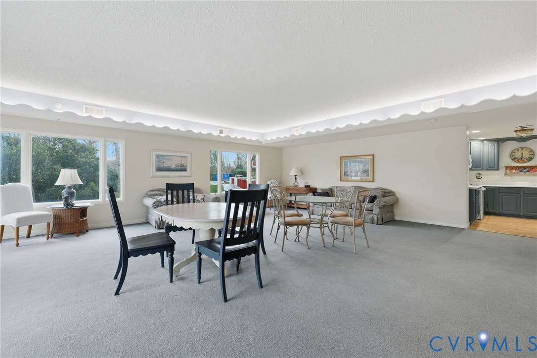 301 Beacon Ridge Drive, Unit 804 Hopewell, VA 23860 - Photo 46 of 64 a dining room with furniture and a floor to ceiling window