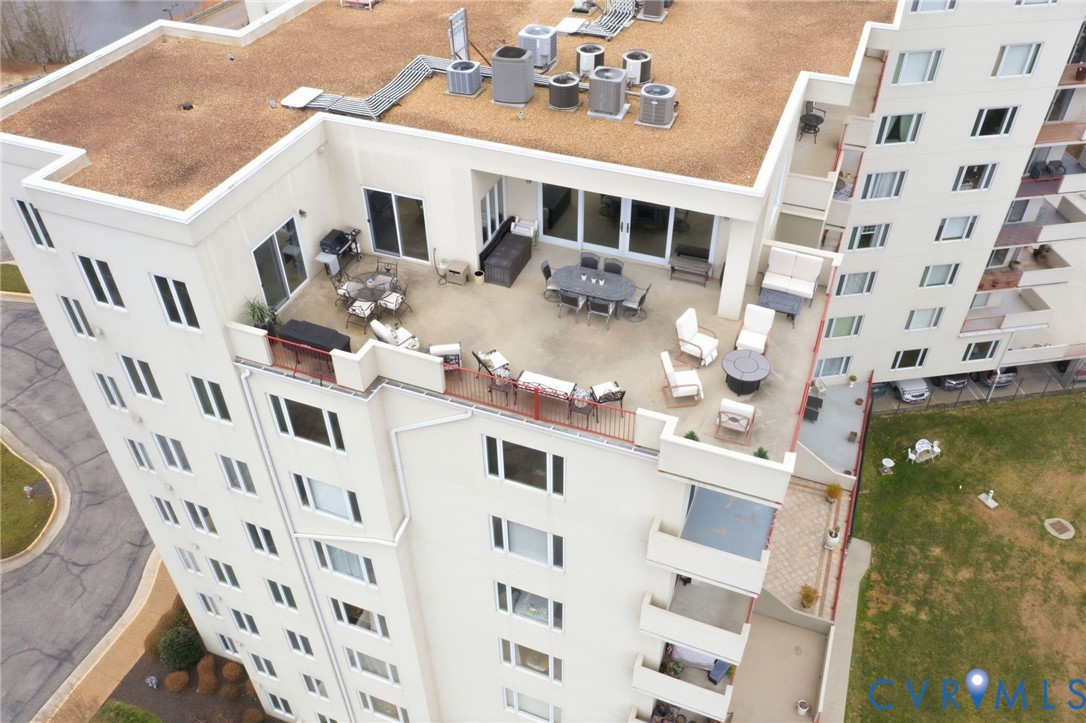 301 Beacon Ridge Drive, Unit 804 Hopewell, VA 23860 - Photo 5 of 64 a view of a building with a lot of windows