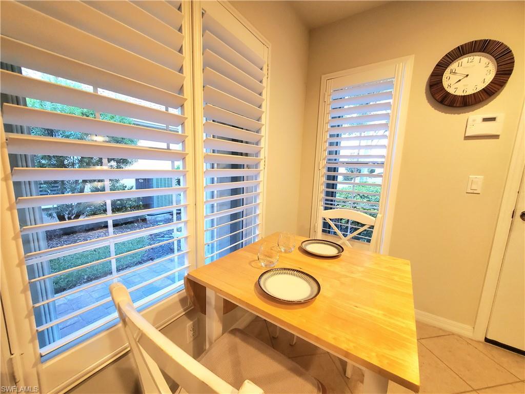 8657 Querce Court Naples, FL 34114 - Photo 23 of 44 a view of a kitchen with a sink and a refrigerator