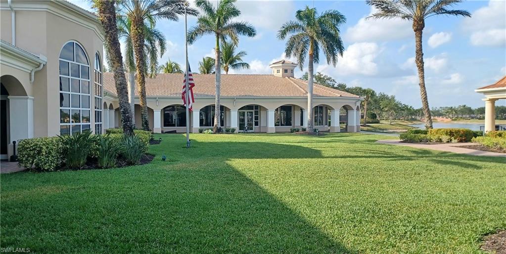 8657 Querce Court Naples, FL 34114 - Photo 39 of 44 a front view of a house with garden and trees