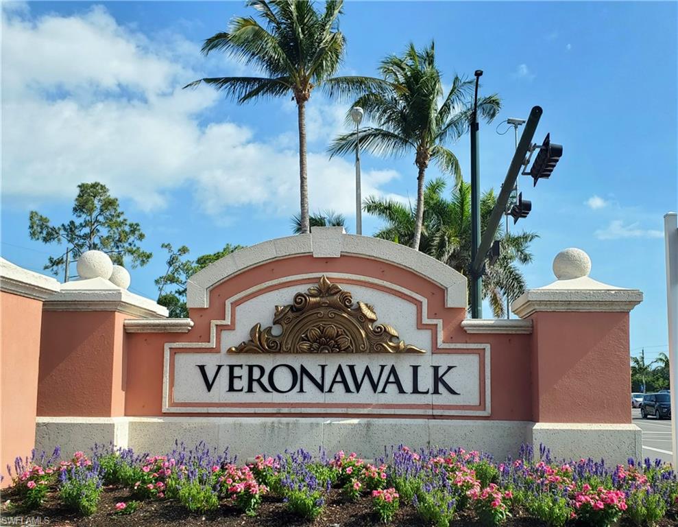 8657 Querce Court Naples, FL 34114 - Photo 41 of 44 a view of sign board with flower around