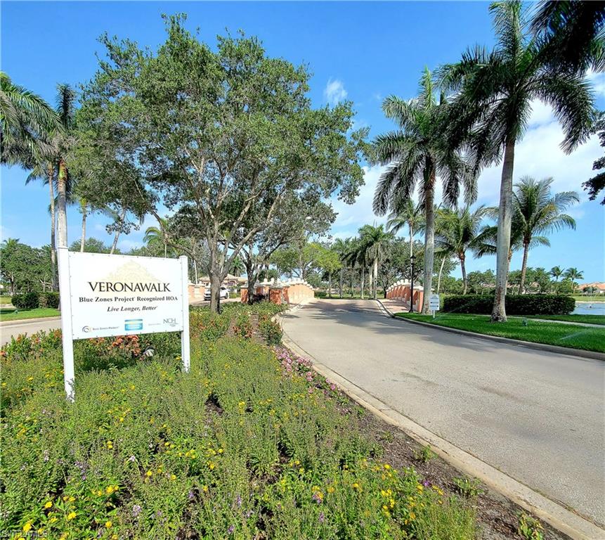 8657 Querce Court Naples, FL 34114 - Photo 43 of 44 a sign board with parking space