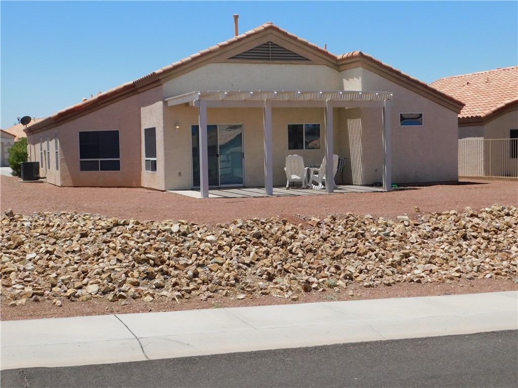 2449 Wilder Road Bullhead City, AZ 86442 - Photo 12 of 45 a front view of a house with a yard