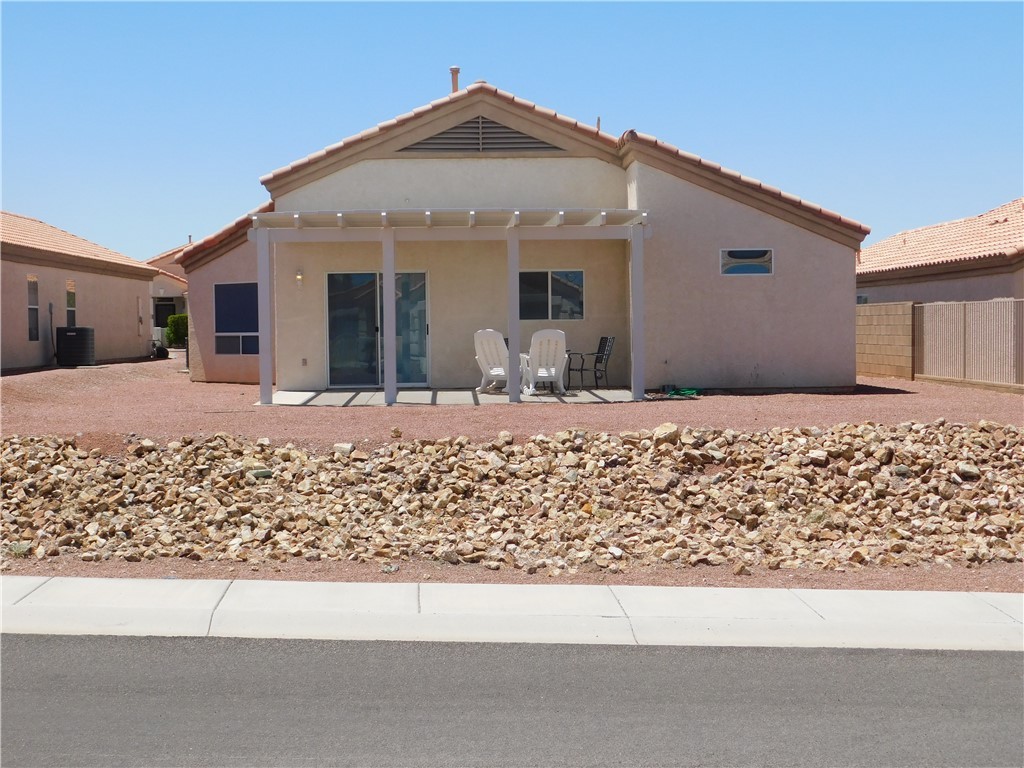 2449 Wilder Road Bullhead City, AZ 86442 - Photo 13 of 45 a front view of a house with a yard
