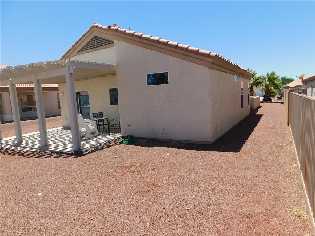 2449 Wilder Road Bullhead City, AZ 86442 - Photo 16 of 45 a view of a house with backyard