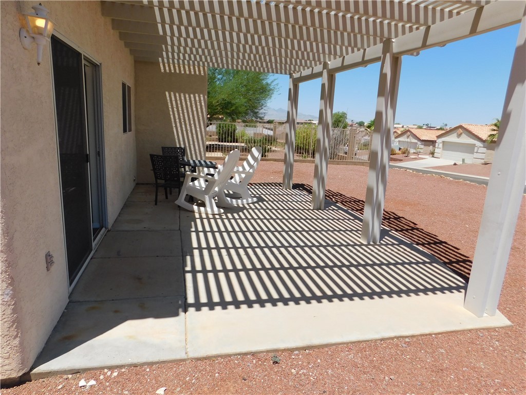 2449 Wilder Road Bullhead City, AZ 86442 - Photo 18 of 45 a view of a porch with wooden floor