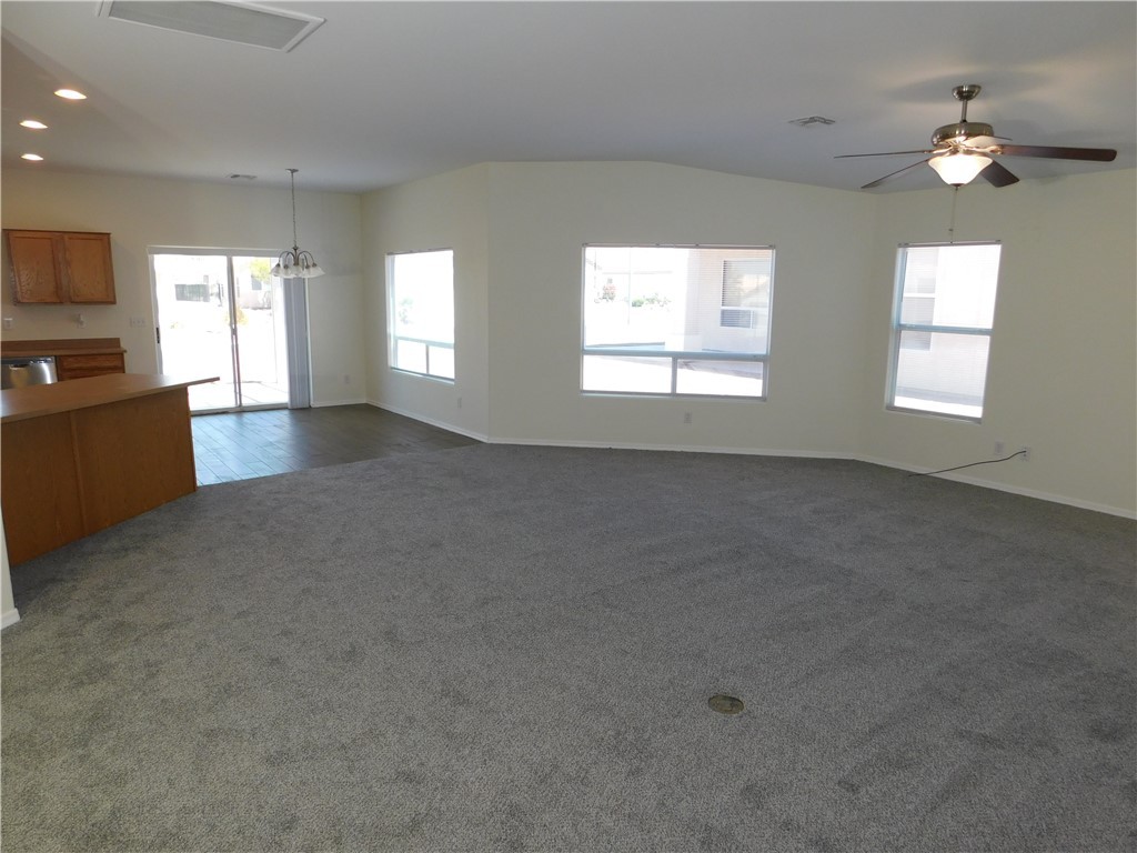 2449 Wilder Road Bullhead City, AZ 86442 - Photo 19 of 45 a view of a livingroom with a ceiling fan and window