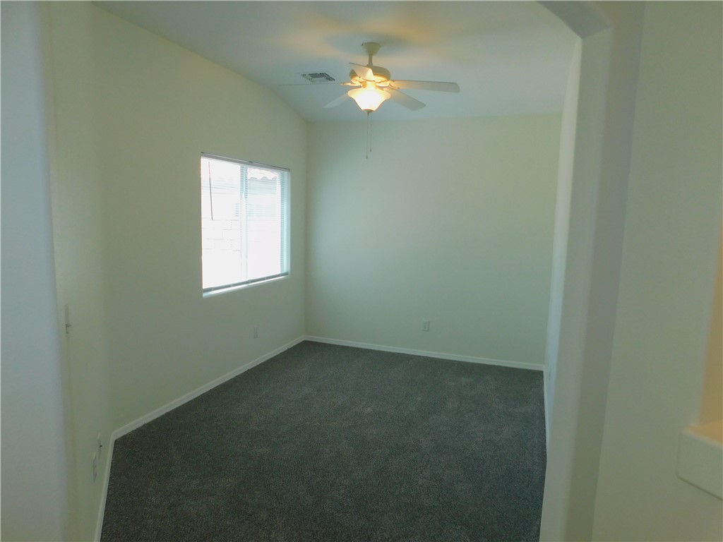 2449 Wilder Road Bullhead City, AZ 86442 - Photo 29 of 45 an empty room with a window and a fan