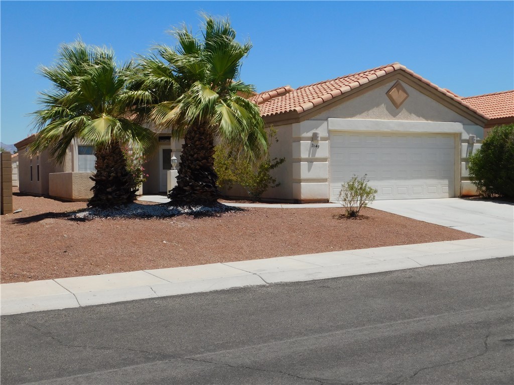 2449 Wilder Road Bullhead City, AZ 86442 - Photo 3 of 45 a front view of house with yard and trees around