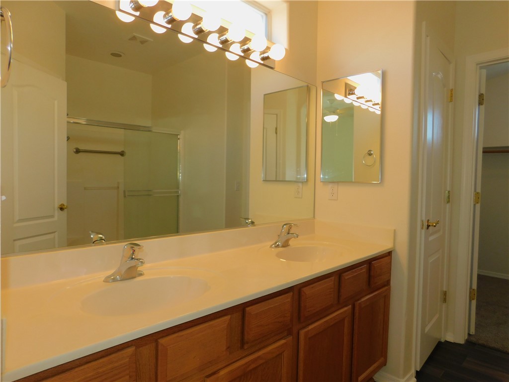 2449 Wilder Road Bullhead City, AZ 86442 - Photo 33 of 45 a bathroom with a sink and a mirror
